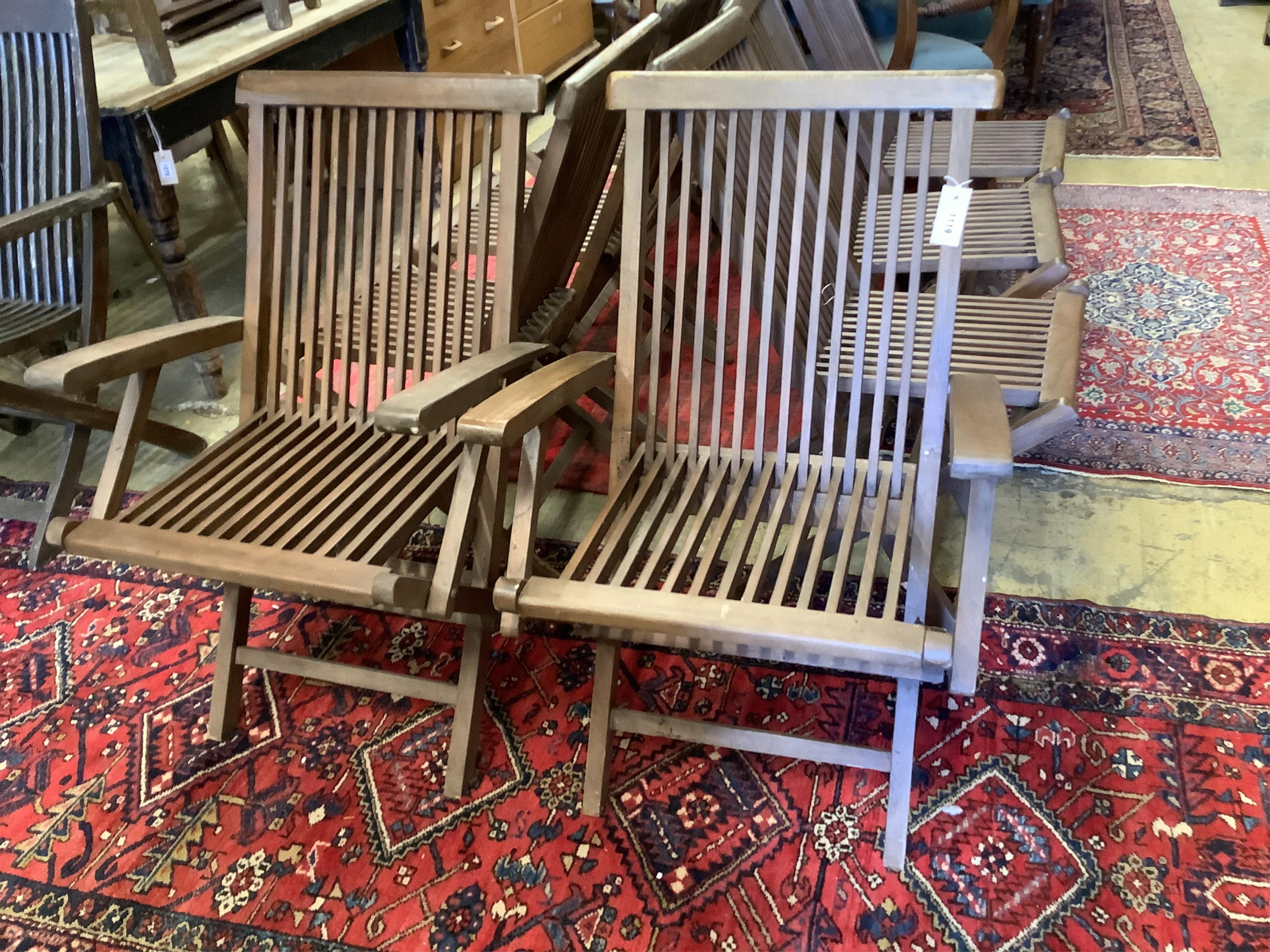 A set of eight teak folding garden chairs (two with arms)